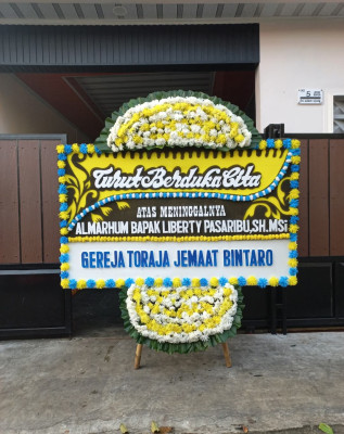 Papan Bunga Duka di Tutulo